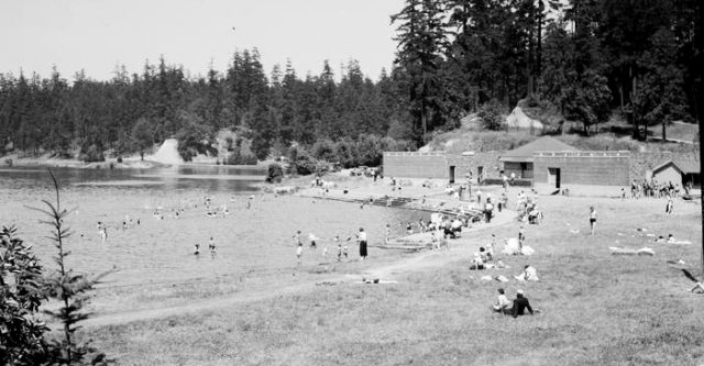 black and white photo of swimming beach